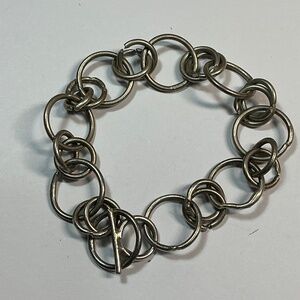 Sterling Silver circles bracelet with toggle closure. 6 inches long